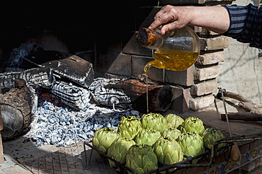 Artichokes With Olive Oil Soon To Be Cooked, Tarragona, Benissanet, Spain