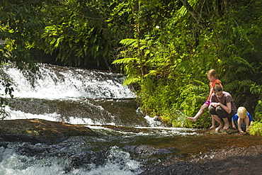 Mother With Boy And Girl Beside Small Waterfalls, Zomba Plateau, Malawi