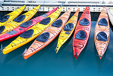 View Of Colorful Kayaks Tied To The Harbor Dock In Valdez, Southcentral Alaska, Summer