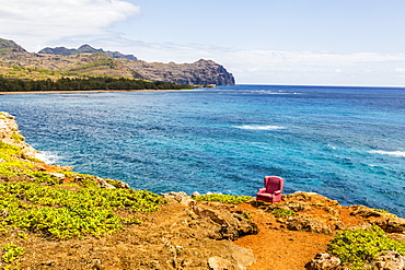 View Of A Red Stuffed Arm Chair Placed On A Cliff Edge, Poipu, Kauai, Hawaii, United States Of America