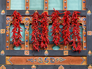 Red Peppers Hanging On An Ornate Wall, Paro, Bhutan