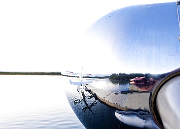 Reflection In Nose Cone Of Floatplane, Alaska, United States Of America