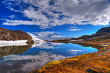 A Crystal Clear Lake Near The Harding Icefield Trail With The Harding Ice Field In The Background, Kenai Fjords National Park, Alaska, United States Of America