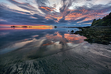 Sunrise And Reflections At Low Tide In Chiniak Bay, Kodiak, Alaska, United States Of America