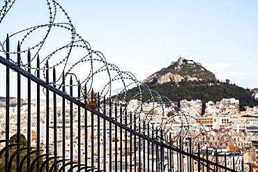 Mount Lycabettus And A Barbed Wire Fence, Athens, Greece