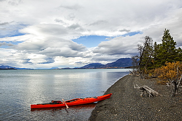 Kayak On The Shore Of Atlin Lake, British Columbia, Canada