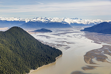 Aerial View Of Woronkofski Island Along The Stikine River Delta, Low Tide Revealing Mud Flats Below The Snow Capped Peaks In The Background, Wrangell, Alaska, United States Of America