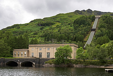 A Building On The Edge Of The Lake And Pipes Going Up The Hillside, Arrochar, Argyll And Bute, Scotland