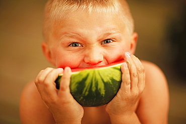 Boy Eating A Slice Of Watermelon