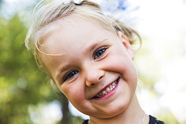 Portrait Of A Young Girl With A Big Smile And Blond Hair, Edmonton, Alberta, Canada