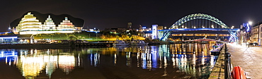 Tyne Bridge Illuminated At Nighttime Over River Tyne And Illuminated Buildings, Newcastle, Tyne And Wear, England