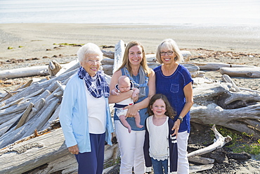 Four Generations Of Women In A Family Posing On A Beach, Fox Spit, Whidbey Island, Washington, United States Of America