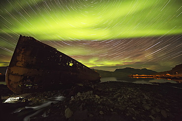 Star Trails And Northern Lights Over Top The Town Of Djupavik In The West Fjords Of Iceland, Djupavik, Iceland