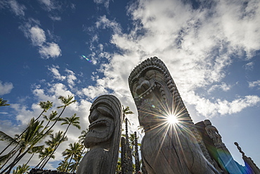 Afternoon Sun Shines Through Statues At Puuhonua O Honaunau National Historic Park, Island Of Hawaii, Hawaii, United States Of America