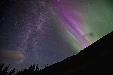 The Milky Way And Aurora Borealis Meet In The Sky Near Girdwood, Southcentral Alaska.