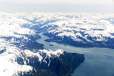 Aerial View Of A Glacier Fjord In The Inside Passage, And Snow Capped Peaks, Wrangell, Southeast Alaska, USA, Spring