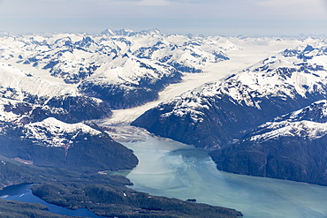 Aerial View Of A Tidewater Glacier In The Inside Passage, And Snow Capped Peaks, Wrangell, Southeast Alaska, USA, Spring