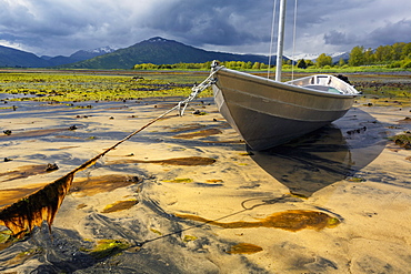 Aluminum Skiff Settles In Sand At Low Tide In Womens' Bay, Kodiak, Alaska