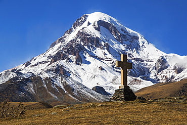 Stone Cross With Mount Kazbek In The Background, Kazbegi, Mtskheta-Mtianeti, Georgia