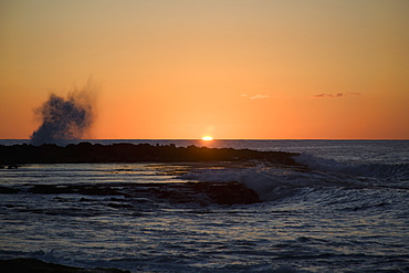 Sunset Over The Ocean With Splashing Waves, Oahu, Hawaii, United States Of America