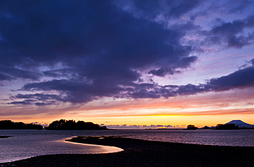 Dramatic Sky At Sunset Over The Ocean And Silhouetted Coastline, Sitka, Alaska, United States Of America