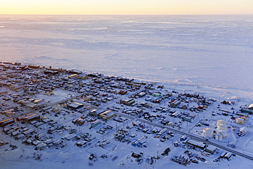 Aerial Sunrise View Of The Village Of Nome On The Seward Peninsula And The Frozen Bering Sea, Nome, Alaska, United States Of America