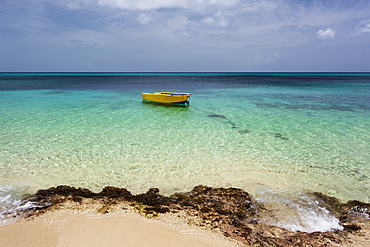 A Lone Boat In The Turquoise Water Off A Tropical Island, Frederiksted, St. Croix, Virgin Islands, United States Of America