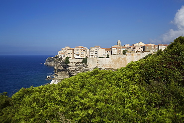 View Of Bonifacio Citadel Perched On Cliffs With Blue Sea, Corsica