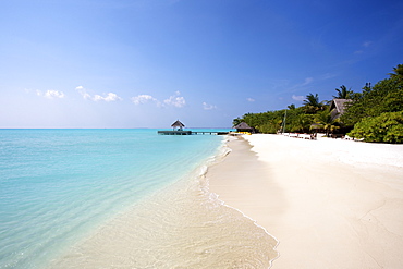 Classic White Sand Beach With Blue Sea And Overwater Cabana