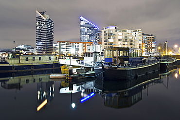 Reflections In Water At Night In Docklands Of London, London, England