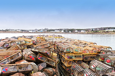 Empty Lobster Traps With The Town Of Ingonish, Nova Scotia In The Background, Ingonish, Nova Scotia, Canada