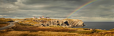 A rainbow across the storm clouds and over the Atlantic ocean and coastline of Newfoundland, Newfoundland, Canada