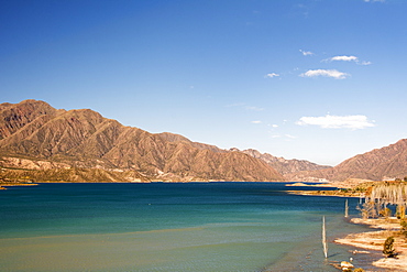 A Lake Surrounded By Colourful Desert Mountains, Potrerillos, Mendoza, Argentina