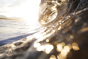 The Barrel Of A Wave Reflects Sunlight On The Ocean, Alaska, United States Of America