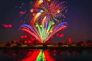 Colourful Fireworks Display Reflected In Water On Canada Day, Edmonton, Alberta, Canada