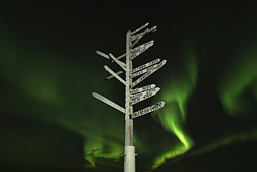 Aurora Borealis In The Sky Above The Signpost On Top Of Keno Hill, Keno, Yukon, Canada