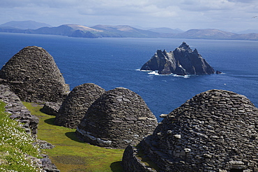 Skellig Michael, County Kerry, Ireland; Stone 'beehive' Monk Huts (Clochans) With A View Of Skellig Beag