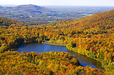 A Lake Surrounded By Forest Area In Autumn; Quebec, Canada