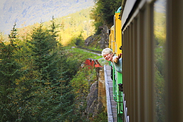 Middle-Aged Woman On White Pass & Yukon Route Train; Skagway, Alaska