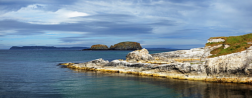 Ballintoy Harbour With Rathlin Island In The Distance; Ballintoy, County Antrim, Northern Ireland