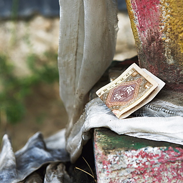 Currency sitting on a step at the drepung monastery, Lhasa xizang china