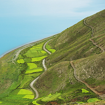 Aerial view of the landscape with fields and a road across the hills, Shannan xizang china