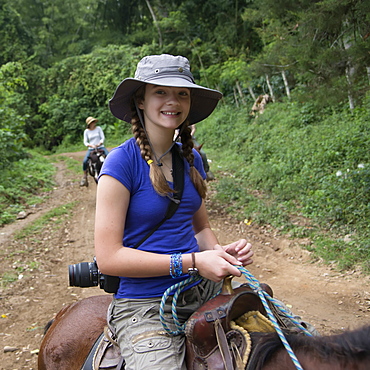 A Girl Riding A Horse On A Trail, Finca El Cisne, Honduras