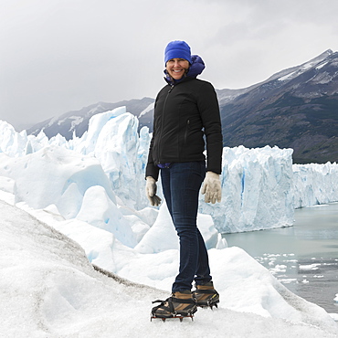 A Woman With Crampon Spikes On Her Hiking Boots On Moreno Glacier, Los Glaciares National Park, Santa Cruz Province, Argentina