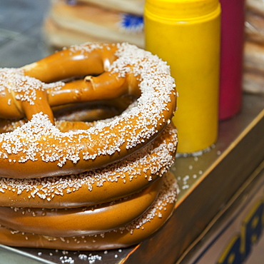 Salted Pretzels And Condiments On A Food Cart, New York City, New York, United States Of America