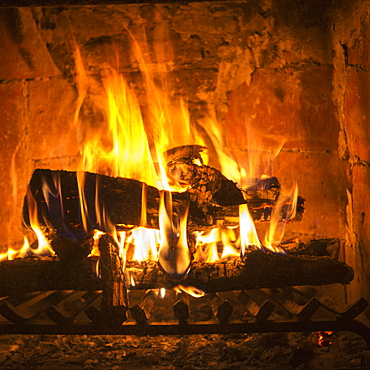 Bright Orange And Yellow Flames In A Burning Fire In A Fireplace, San Miguel De Allende, Guanajuato, Mexico