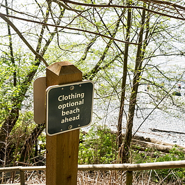 Sign On The Shore For A Beach Where Clothing Is Optional, Vancouver, British Columbia, Canada