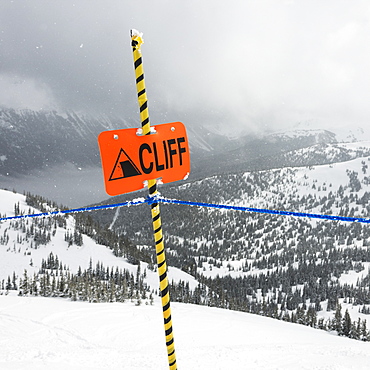 A Caution Sign At A Ski Resort Warning Of A Cliff, Whistler, British Columbia, Canada