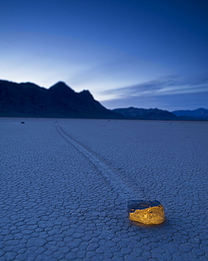 A Rock Formation Glowing On The Arid Ground In The Mojave Desert; Death Valley California United States Of America