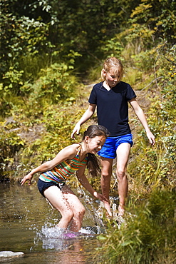 Two Girls Playing In Water